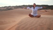 Woman doing yoga in the wilderness at sunset against a beautiful