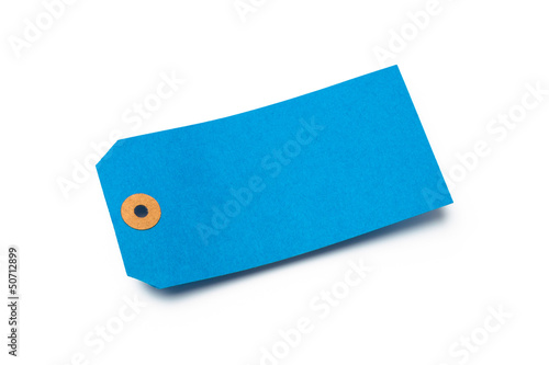 Photo: Blue cardboard or paper luggage tag isolated on white Blue cardboard or paper luggage tag isolated on white