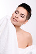 Young woman with short haircut in towel