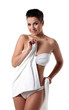 Young woman with short haircut in towel
