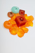 Spilt petals of the orange-rose around the aromatic candle