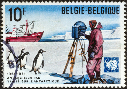 Photo: Scientist, Adelie penguins and ship "Erika Dan" (Belgium 1971) Scientist, Adelie penguins and ship "Erika Dan" (Belgium 1971)