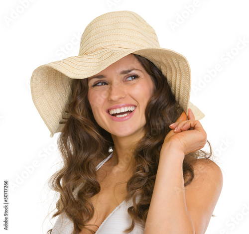 Photo: Portrait of happy young woman in hat Portrait of happy young woman in hat