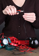 Human makes timebomb on wooden table on black background