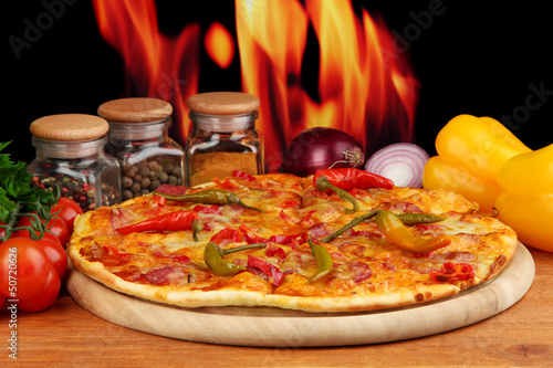 Photo: Tasty pepperoni pizza with vegetables Tasty pepperoni pizza with vegetables