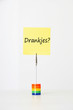 Photo: Sticky notepaper with Dutch text meaning "Drankjes?" (Drinks) clipped to a multicolored card holder Sticky notepaper with Dutch text meaning "Drankjes?" (Drinks) clipped to a multicolored card holder