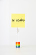 Photo: Sticky notepaper with Spanish text "se acabo" (It's over) clipped to a multicolored card holder Sticky notepaper with Spanish text "se acabo" (It's over) clipped to a multicolored card holder