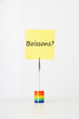 Photo: Sticky notepaper with French text "Boissons?" (drinks) clipped to a multicolored card holder Sticky notepaper with French text "Boissons?" (drinks) clipped to a multicolored card holder