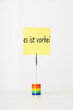 Photo: Sticky notepaper with German text "es ist vorbei" (It's over) clipped to a multicolored card holder Sticky notepaper with German text "es ist vorbei" (It's over) clipped to a multicolored card holder