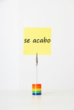 Photo: Sticky notepaper with Spanish text "se acabo" (It's over) clipped to a multicolored card holder Sticky notepaper with Spanish text "se acabo" (It's over) clipped to a multicolored card holder