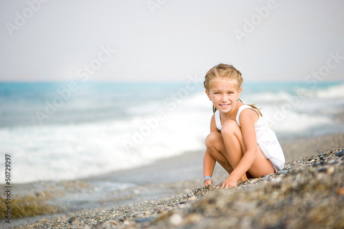 Photo: little girl on the beach little girl on the beach