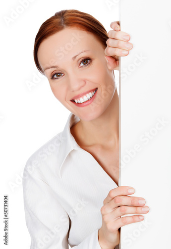 Photo: young business woman with a blank signboard young business woman with a blank signboard