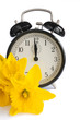 Vintage alarm clock, yellow daffodils, spring, dst.