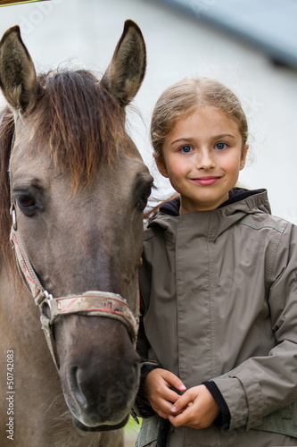 Photo: Horse and lovely equestrian girl Horse and lovely equestrian girl