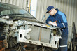 worker at car repair determination