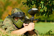 Photo: paintball player holding fire paintball player holding fire
