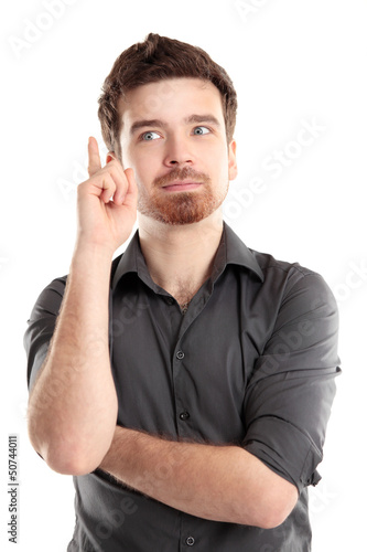 Photo: I got an idea - Surprised young businessman isolated I got an idea - Surprised young businessman isolated