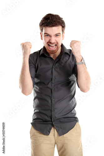 Photo: Excited handsome business man with arms raised in success Excited handsome business man with arms raised in success