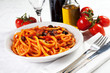 pasta with olives, bacon and sauce