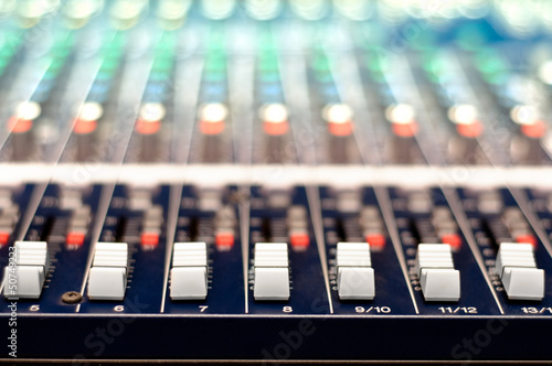 Photo: Close-up of music controls buttons of studio mixer Close-up of music controls buttons of studio mixer