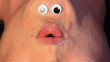 Mrs Chinigan whistles.  Cartoon eyes on inverted female face.
