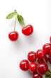 Red cherry with leaves on white