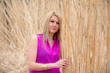 Blonde Girl With Pink Shirt In Reed