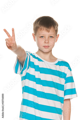 Photo: Young boy shows victory sign Young boy shows victory sign