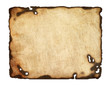 Old  paper with burnt edges isolated on white background.