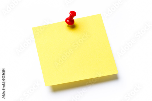 Photo: Yellow sticky note isolated on white Yellow sticky note isolated on white
