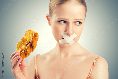 Photo: diet concept. woman mouth sealed with duct tape with buns diet concept. woman mouth sealed with duct tape with buns