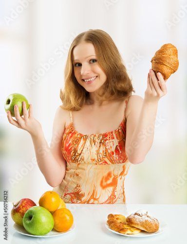 Photo: woman choose between healthy and unhealthy food woman choose between healthy and unhealthy food