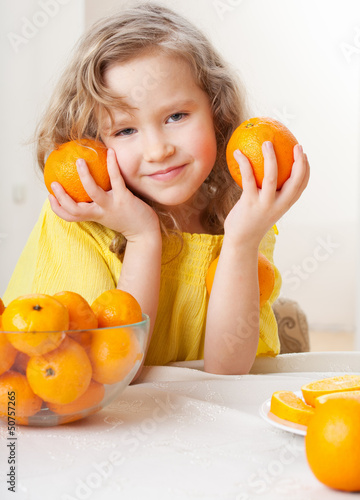 Photo: Child with oranges Child with oranges