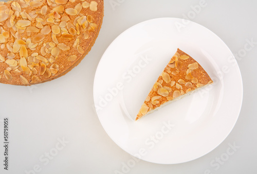 Photo: almonds piece dessert on white plate almonds piece dessert on white plate