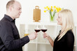 Man and woman toasting each other