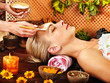 Woman getting  facial massage .