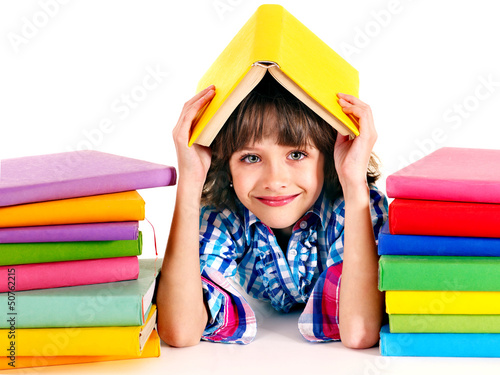 Photo: Child with stack of books. Child with stack of books.