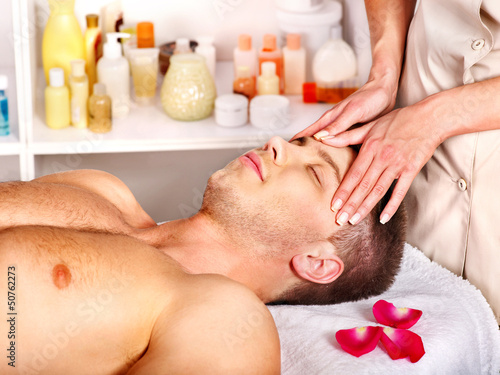 Photo: Man getting facial massage . Man getting facial massage .