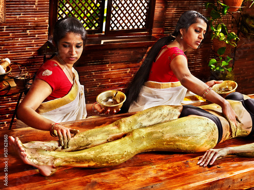 Photo: Woman having Ayurvedic feet spa massage. Woman having Ayurvedic feet spa massage.
