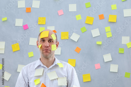 Photo: businessman with many notes businessman with many notes