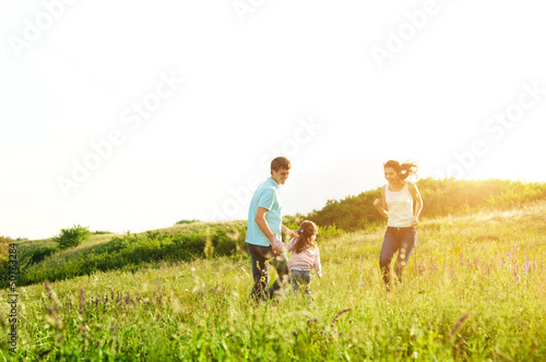 Photo: happy family having fun outdoors happy family having fun outdoors