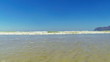 Small ocean waves running into camera