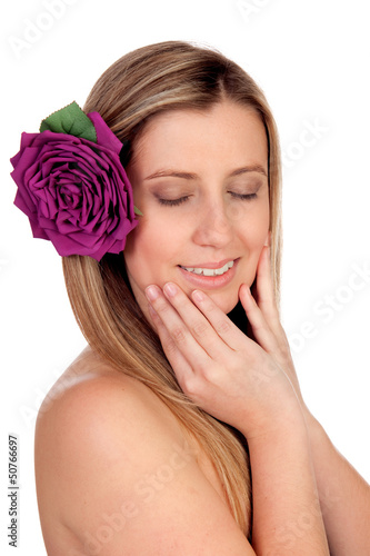 Photo: Beautiful girl isolated with a rose on the hair Beautiful girl isolated with a rose on the hair