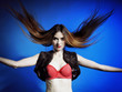 Fashion model with hair blowing in the wind
