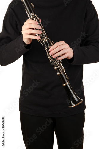 Photo: Musician playing on clarinet isolated on white Musician playing on clarinet isolated on white
