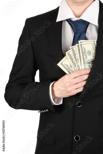 Photo: Business man hiding money in pocket isolated on white Business man hiding money in pocket isolated on white