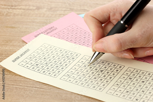 Photo: Closeup of lotto ticket during the marking of numbers, Closeup of lotto ticket during the marking of numbers,