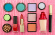 Decorative cosmetics on pink background