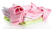 Pile of baby clothes isolated on white