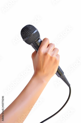 Photo: Woman hand with microphone Woman hand with microphone